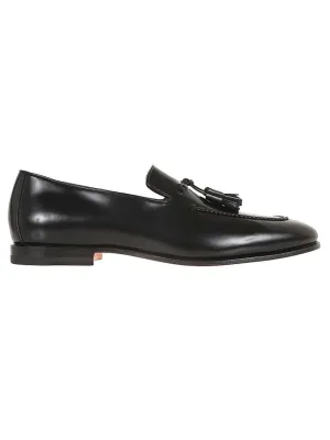 Black Leather Moccasin With Tapered Toe And Decorative Tassels